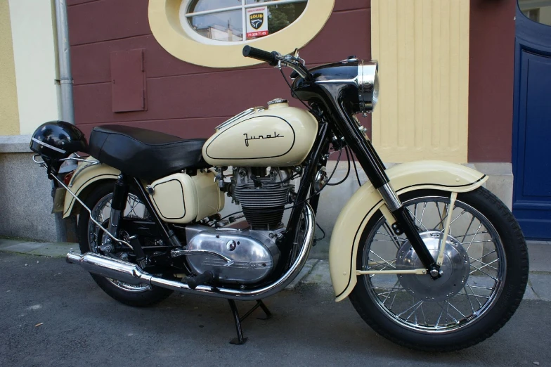 a motorcycle parked in front of a building, by Josef Abel, flickr, 50s style, beige, pulsar, interesting color scheme