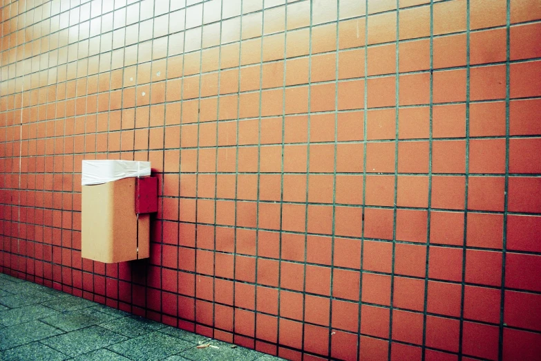 a red brick wall with a toilet paper dispenser, a stock photo, by Andrei Kolkoutine, postminimalism, red grid, deserted shinjuku junk, ffffound, in retro colors