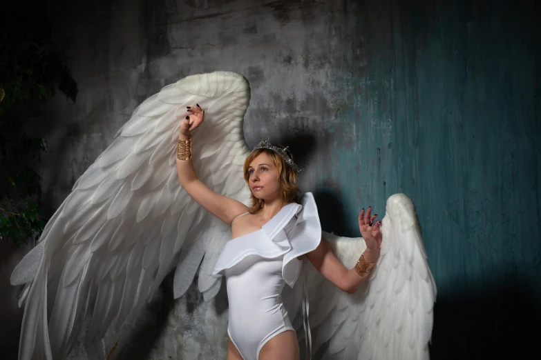 a woman in a white bodysuit with angel wings, inspired by David LaChapelle, pixabay, renaissance, elderly greek goddess, cosplay photo, sergey vasnev, madonna