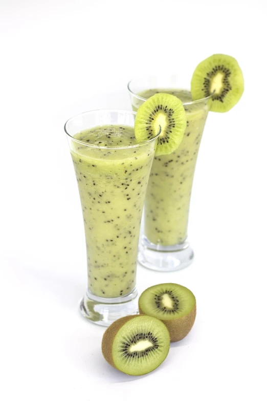 two glasses of kiwi smoothie with slices of kiwi, hurufiyya, fully body photo