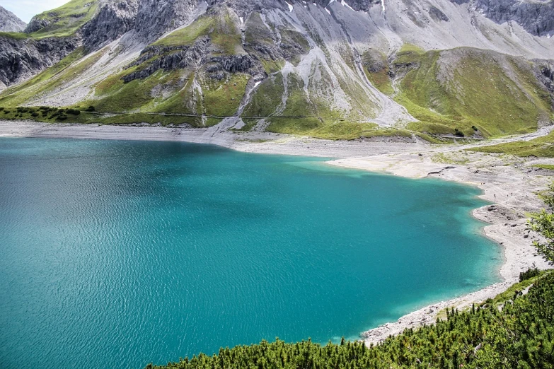 a large body of water surrounded by mountains, by Werner Andermatt, pixabay, beach is between the two valleys, very detaile, high quality desktop wallpaper, drone photograpghy