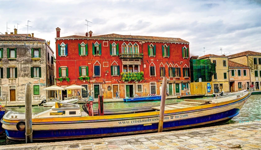 a boat that is sitting in the water, a photo, inspired by Quirizio di Giovanni da Murano, pexels contest winner, renaissance, colorful house, 🦩🪐🐞👩🏻🦳, john singer sargent style, # 2 2 3 3 e 6