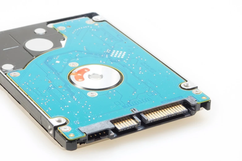 a hard drive sitting on top of a white surface, a stock photo, by Lena Alexander, printed circuit board, highly detailed product photo, close-up product photo, high details photo