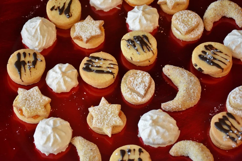 several decorated cookies in the shape of crescent and stars