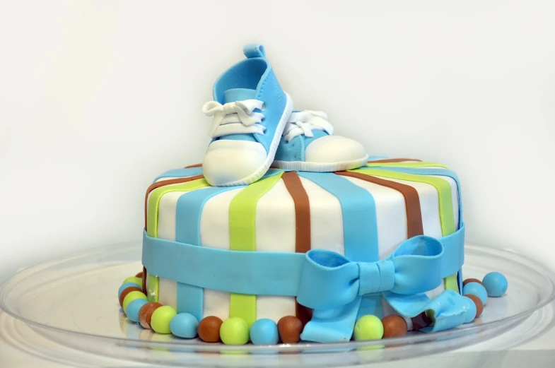 this is a cake with colorful decorations and a tennis shoe