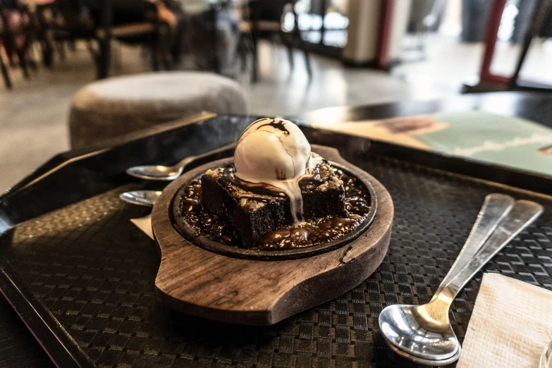 desert with a scoop of ice cream sitting on a table