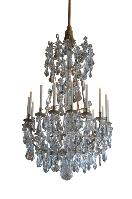 a chandelier with many lit candles around it