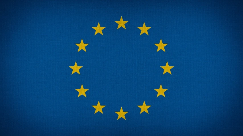 a flag with gold stars is shown on a dark background