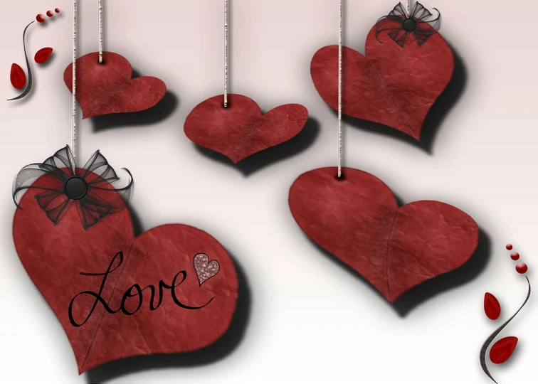 heart shaped tags with words love hanging from strings