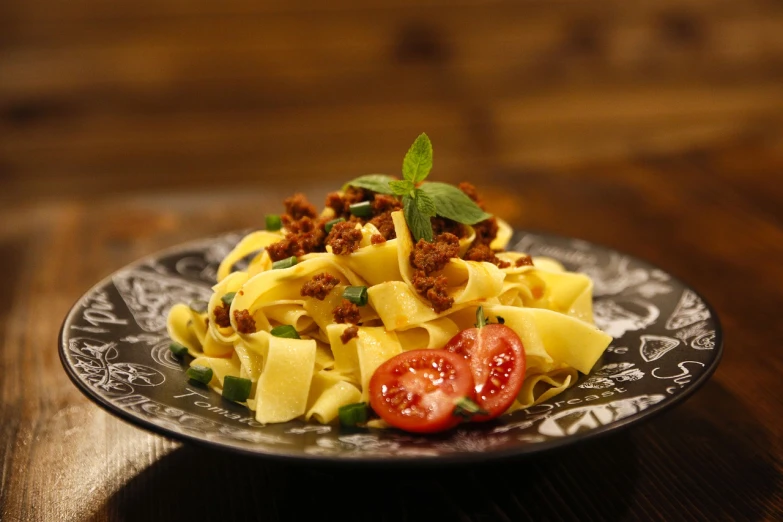 a plate with some noodles and some meat