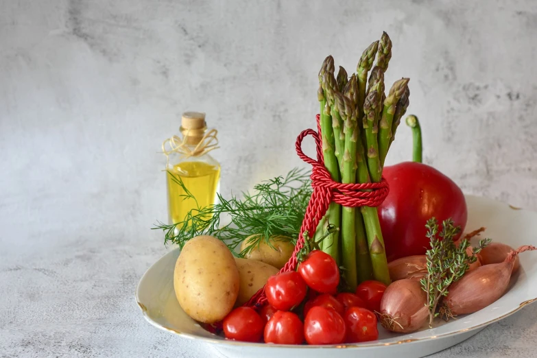 some vegetables and fruits on a white plate