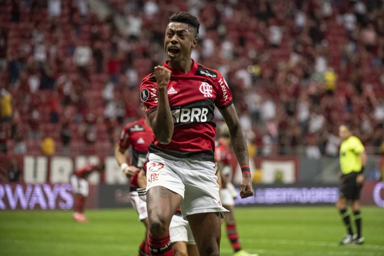 a soccer player is celeting the goal during a match