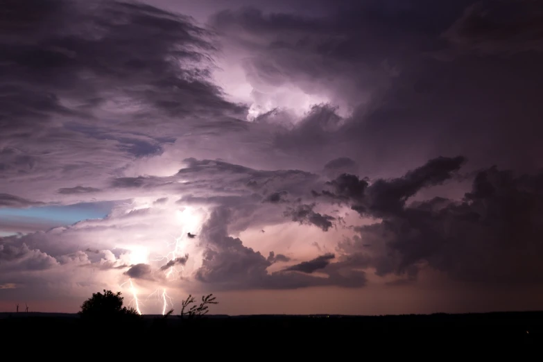 the clouds are bright pink and purple at night