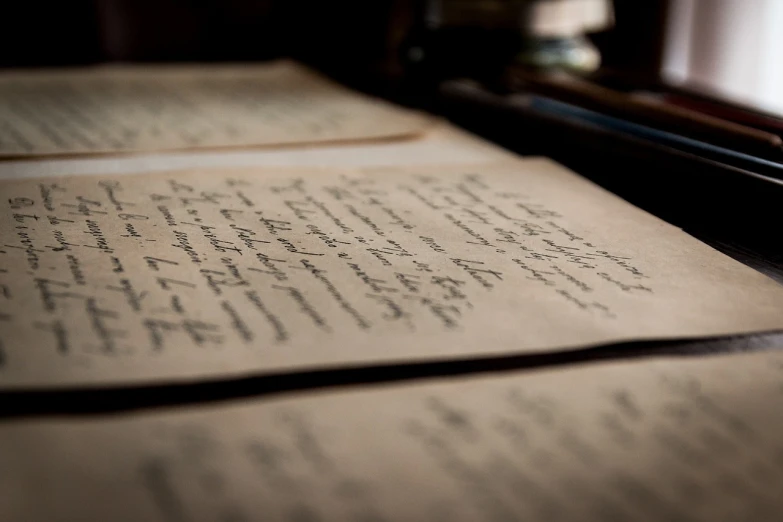 several papers spread out across a desk