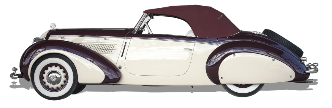 an old white and maroon car on a black background