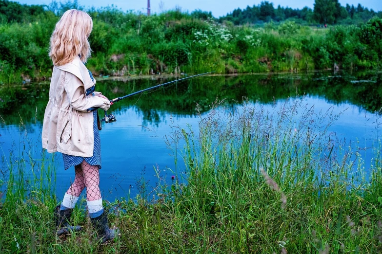  fishing along a pond in the fall