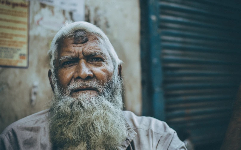 a person with long hair and a beard