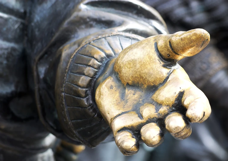 a close up po of a person wearing an arm statue