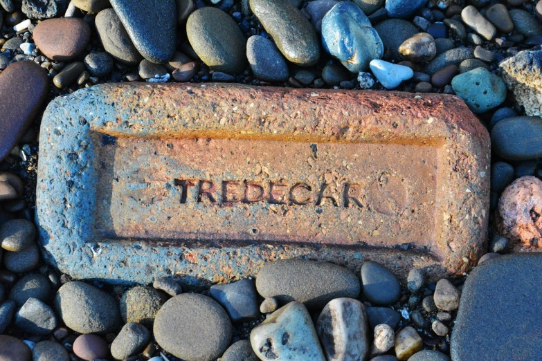 an old sign on a rock with the word trekak written on it