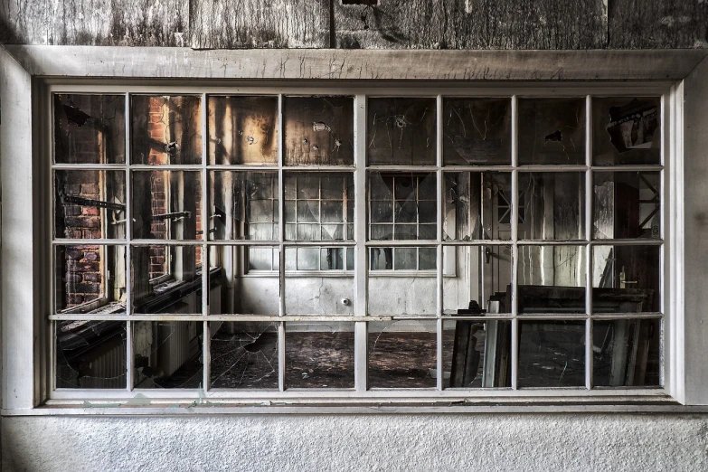 window panes in an abandoned building in the midst of day