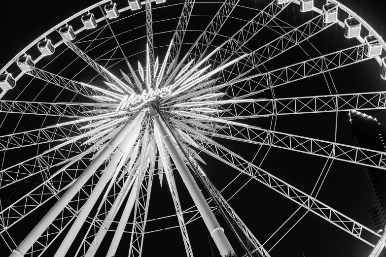 a ferris wheel that is lit up in the night