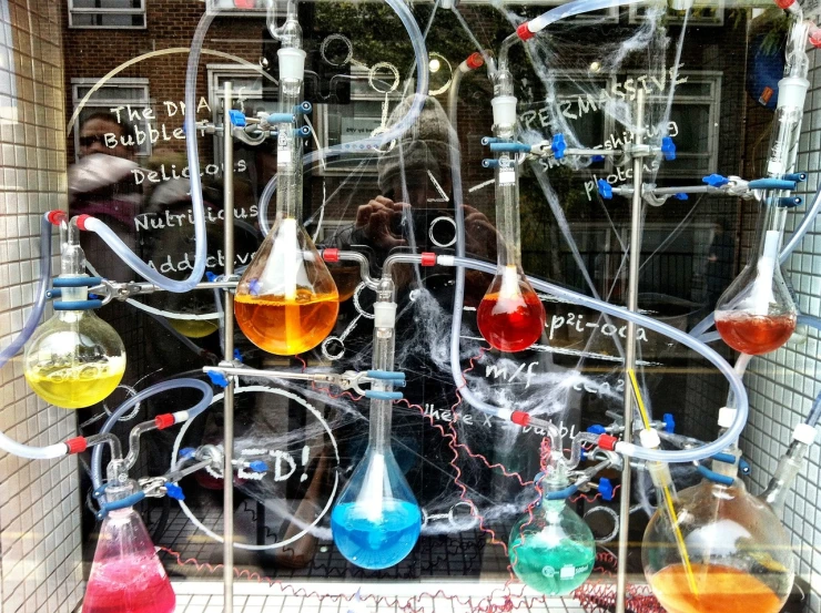 a store display in a window filled with different types of liquid