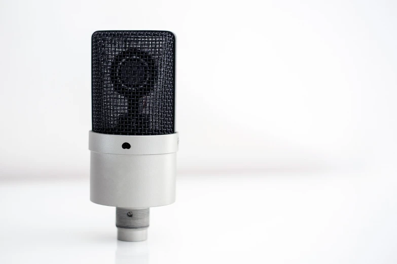 a microphone that is in a white studio setting