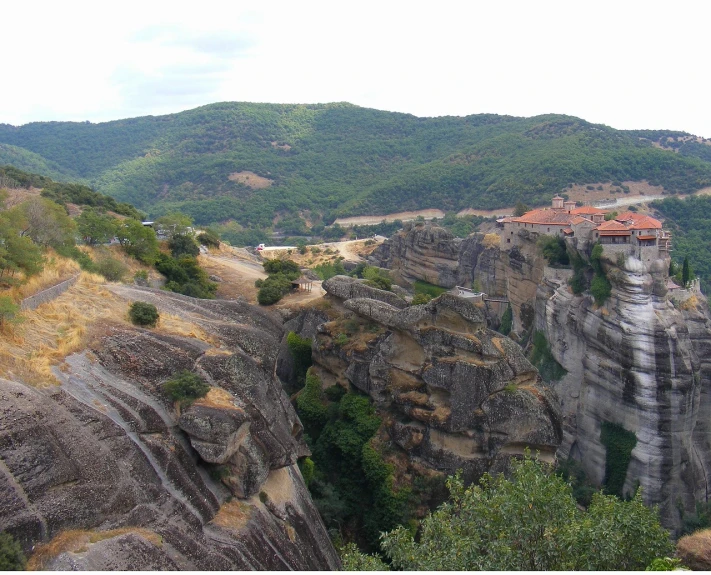 the cliffside area has a building and small village on it