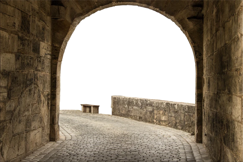 a view of a brick road through a tunnel