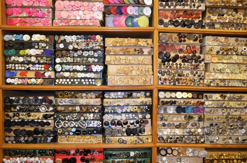 a display of various on badges and other jewelry items