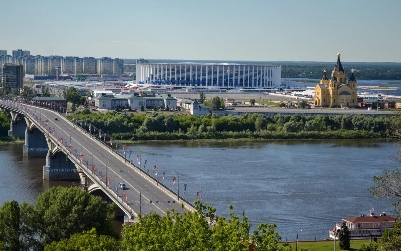 a bridge over a body of water leading into a city