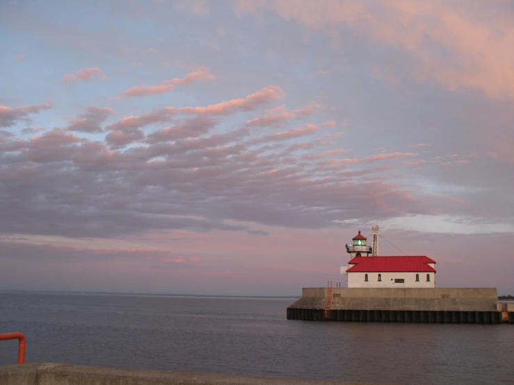 a lighthouse on the side of a body of water