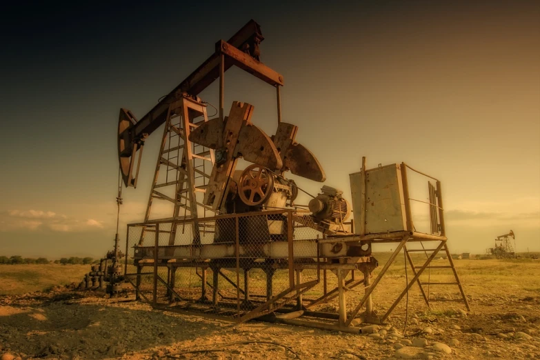 a well is on the edge of some dirt