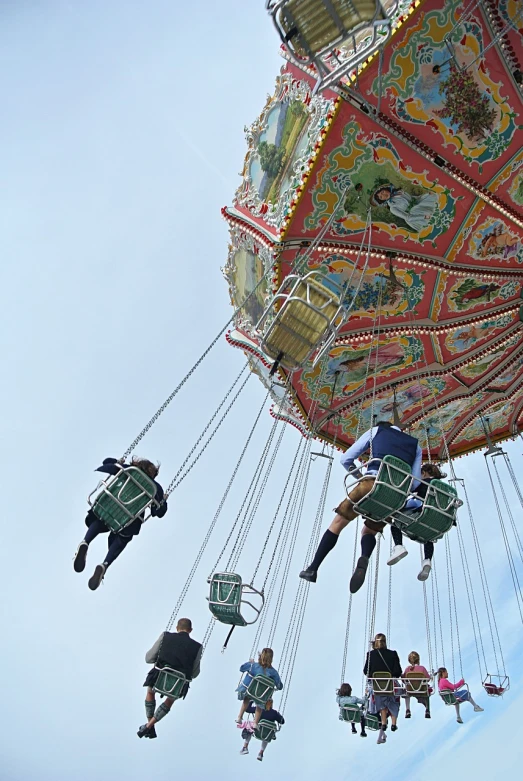 a group of people ride in a carnival ride