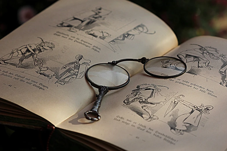 a magnifying glass and some book pages