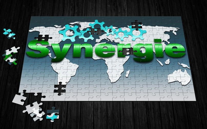 a jigsaw puzzle on top of a table that says synergle