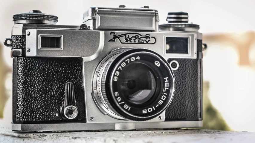 a small, old style camera sitting on a counter