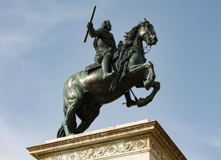 a large statue of a man on top of a horse