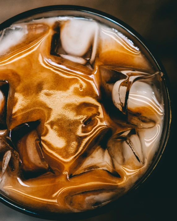 ice cream coffee inside a glass on top of the table