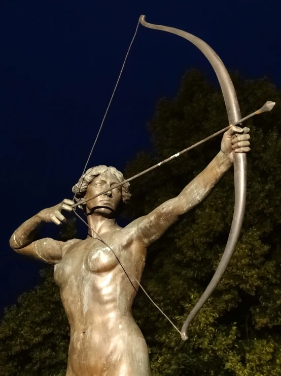 a statue with a bow and arrow in his hands