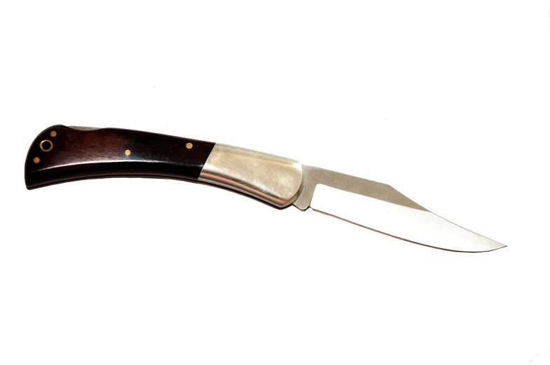 an open knife with wooden handle on white background