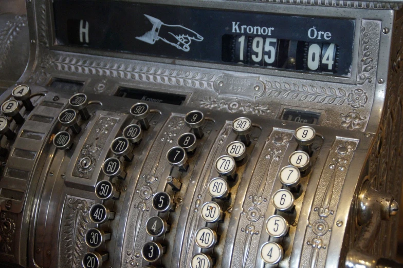 an old fashioned typewriter is shown with numbers displayed