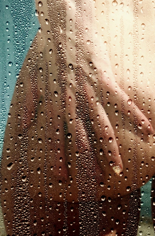 some water drops are falling on a persons body