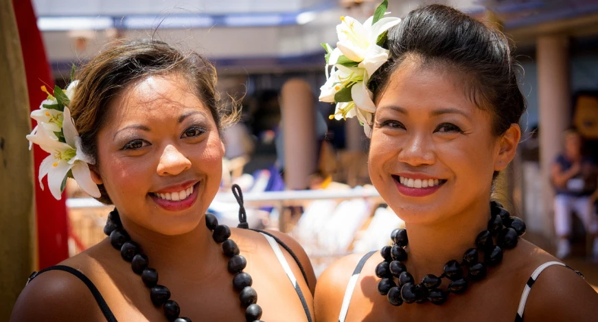 a couple of young women standing next to each other