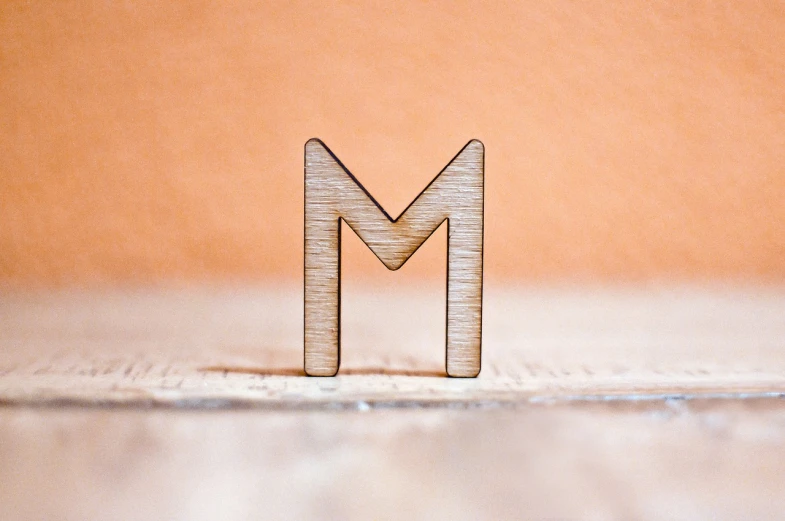 wooden letter magnets sitting on a table