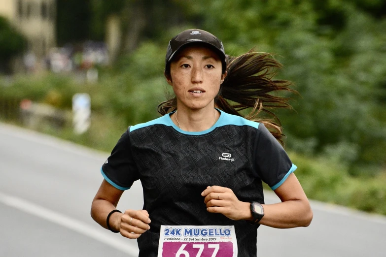 a woman is running in a marathon