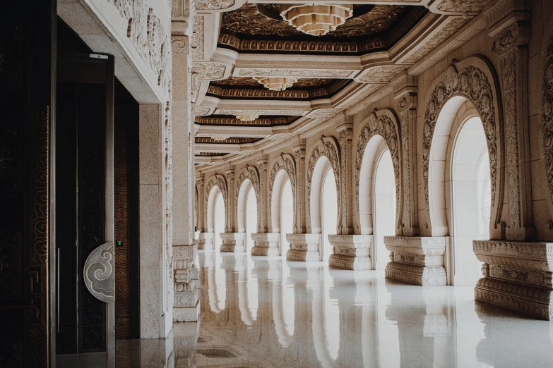 an elegant looking hallway with arches and doorways