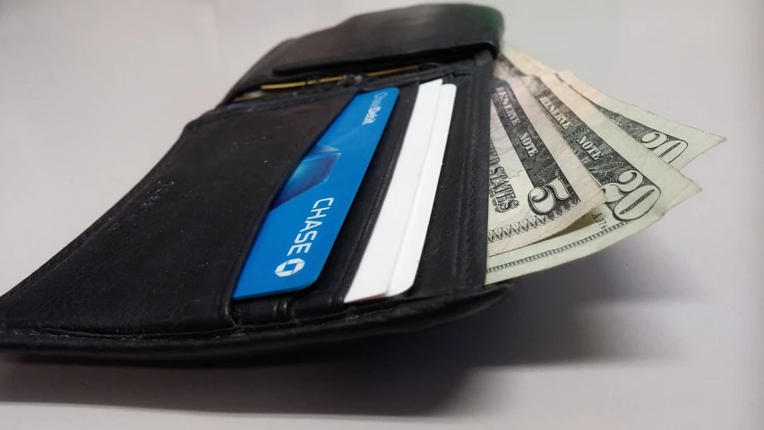 a wallet with several bank notes inside