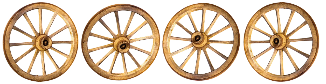 three old wheel wheels with some red and yellow streaks on them