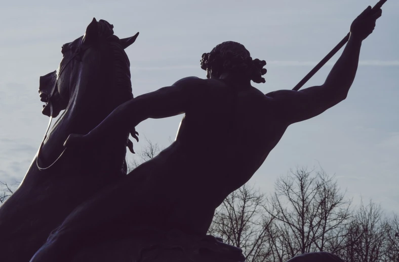 a couple of statues on top of a statue